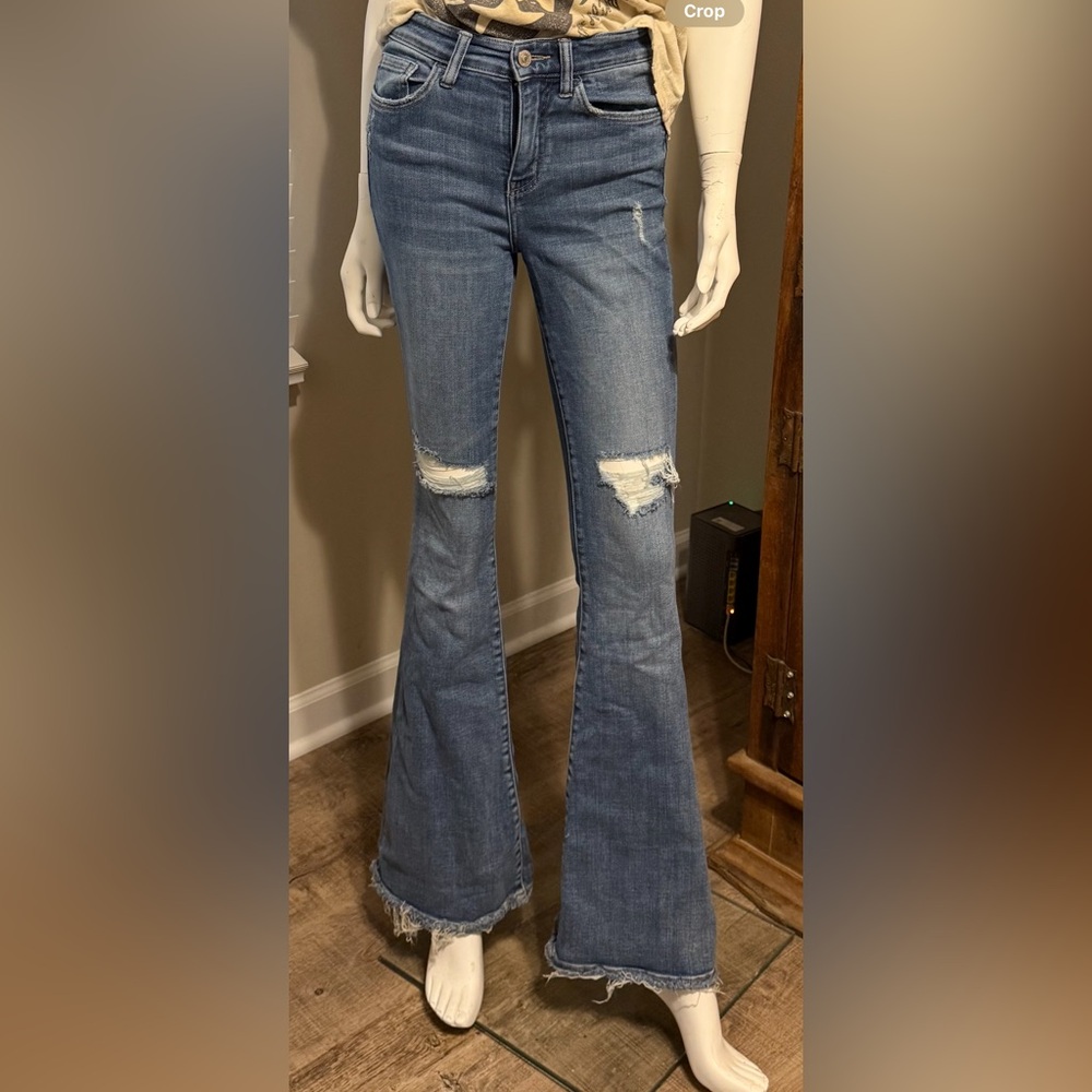 Ripped bell bottom jeans